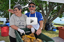photo of Pat and Steve Lenox serving food at the 2011 Kettle Clambake